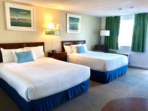 Ένα ή περισσότερα κρεβάτια σε δωμάτιο στο GuestLodge