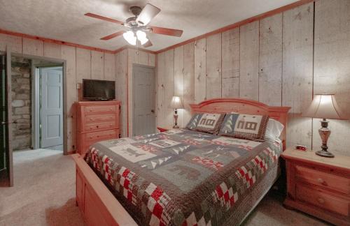 a bedroom with a bed and a ceiling fan at Swiss Mountain Village in Blowing Rock
