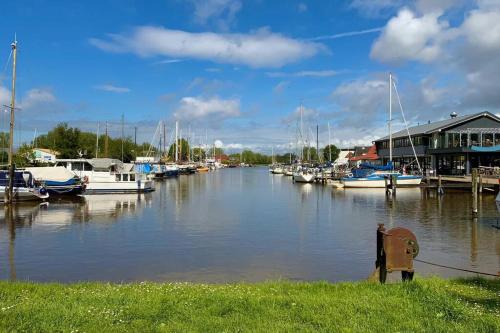 a marina with boats in the water and houses at Ferienwohnung Loft 1 in Varel