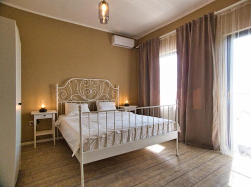 Tempat tidur dalam kamar di REȘEDINȚA PRINȚESELOR
