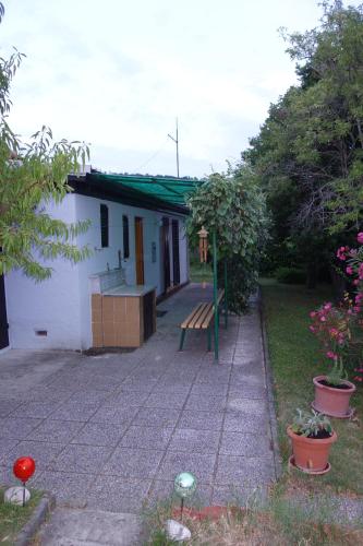 a house with a bench in front of it at Apartma Korelc in Koper