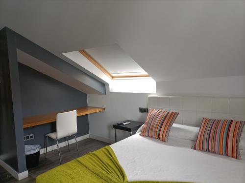 En eller flere senge i et værelse på Casa Mar Da Villa Restaurant Hotel