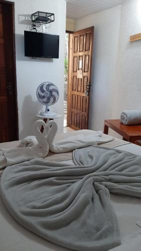 Ένα ή περισσότερα κρεβάτια σε δωμάτιο στο Pousada de serra TUTUCA