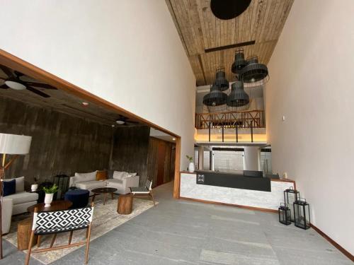 a living room with a couch and a table at Ximena Hotel Boutique in Sayulita