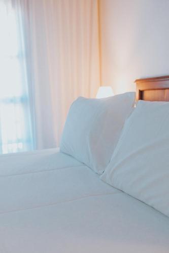 Katil atau katil-katil dalam bilik di Hotel L' Hirondelle