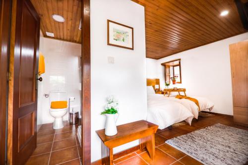 Postel nebo postele na pokoji v ubytování Villa Dos Cedros