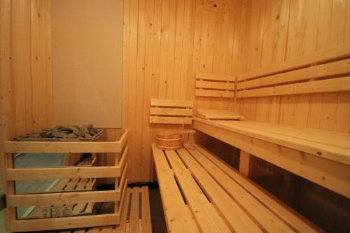 a sauna with wooden walls and wooden benches at The Lion Hotel in Blaenavon