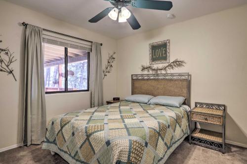 a bedroom with a bed and a ceiling fan at Hildas Cabin Mtn-View Retreat in Pine! in Pine