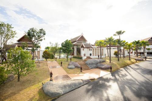 an aerial view of a house with a park at Thantara Resort Chiang Mai in Chiang Mai
