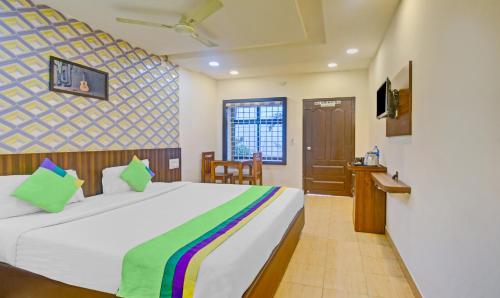 Katil atau katil-katil dalam bilik di Itsy Hotels Igloo Residency Raja Seat
