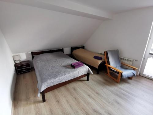 Кровать или кровати в номере Ranczo Kaletnik