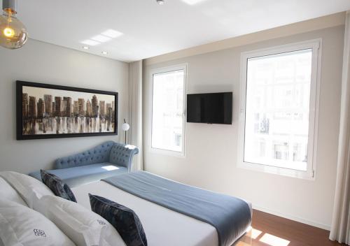 Una cama o camas en una habitación de GuimaGold
