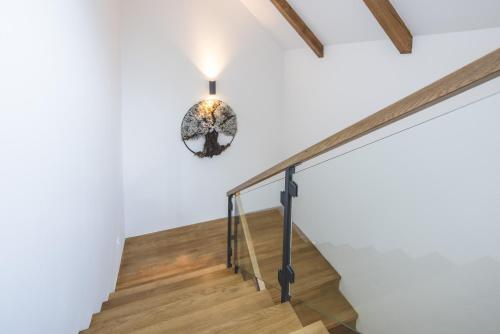 a staircase in a house with a light fixture at Forest Resort in Vír