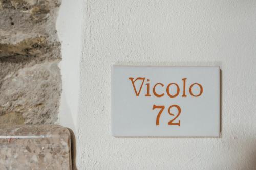 a sign on a wall that reads vatican at Vicolo72 in Calitri