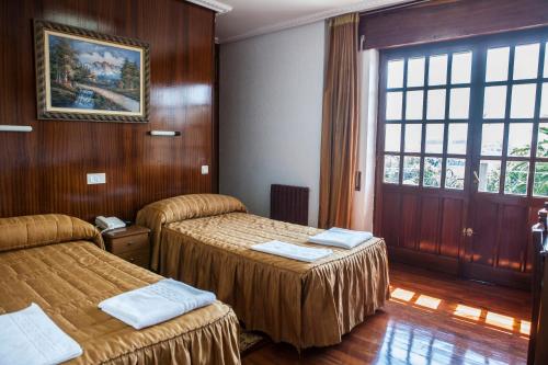Postel nebo postele na pokoji v ubytování Hotel Antoyana
