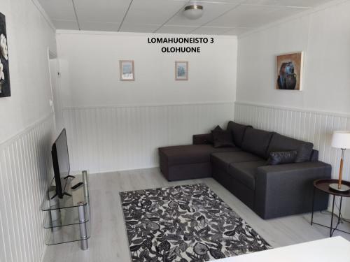 a living room with a couch and a table at Camping Lappeenranta in Lappeenranta