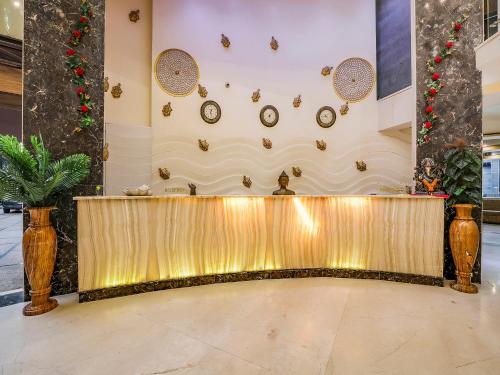a lobby with a reception desk in a building at Grandeur De Sanchi- Luxury Beach Resort & Spa in Calangute