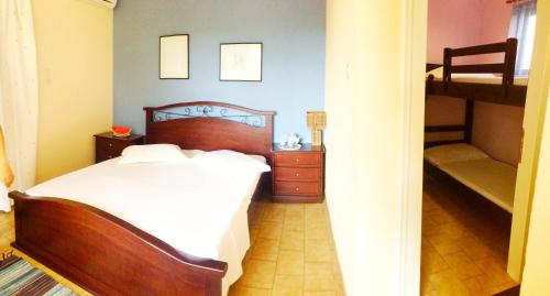 a bedroom with a bed and a bunk bed at Aenaon Studios in Oreoí