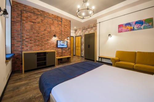 Кровать или кровати в номере Central Apartments Maidan Area