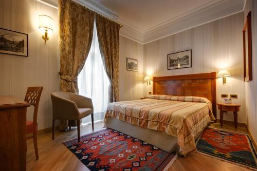 a hotel room with a bed and a window at Residenza RomaCentro in Rome