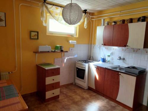 a small kitchen with a stove and a sink at Apartment in Balatonalmadi/Balaton 17977 in Balatonalmádi