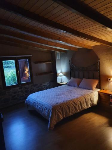 a bedroom with a large bed in a room at casa cristimil -san amaro in Salamonde