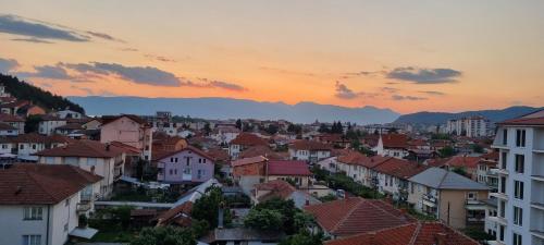 a view of a city at sunset with buildings at Svir Skyline Apartment No 39 in Ohrid