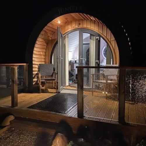 a room with an open door to a patio at Loch Leven Hotel & Distillery in Glencoe
