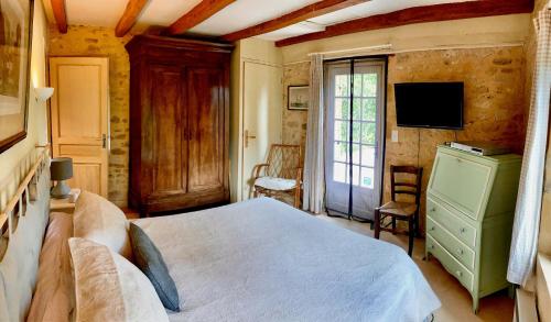 Ένα ή περισσότερα κρεβάτια σε δωμάτιο στο Gîte Le Recoux