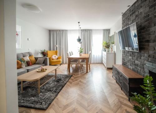 a living room with a couch and a table at Kościerzynkowo in Kościerzyna
