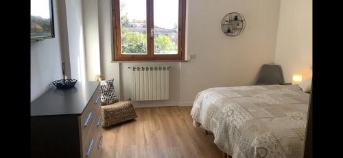 a bedroom with a bed and a window at SMartspot Rosia in Rosia