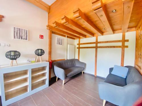 a living room with two chairs and a couch at Zajazd Jonatan in Czernin