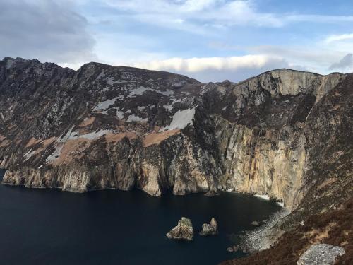 an island in the middle of a mountain lake at Bayview Country House B&B - F94 VK64 in Ardara
