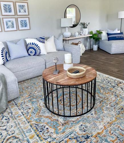 a living room with a couch and a coffee table at The Beach House at Seascape Steps from the Beach, Marina and Shops! in West Palm Beach