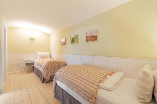 Postel nebo postele na pokoji v ubytování Vorgarten Apartments - central, new and stylish for your comfortable stay in Vienna