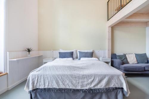 Postel nebo postele na pokoji v ubytování Vorgarten Apartments - central, new and stylish for your comfortable stay in Vienna