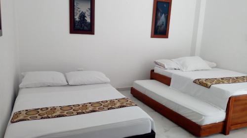 En eller flere senge i et værelse på VILLA MORELI