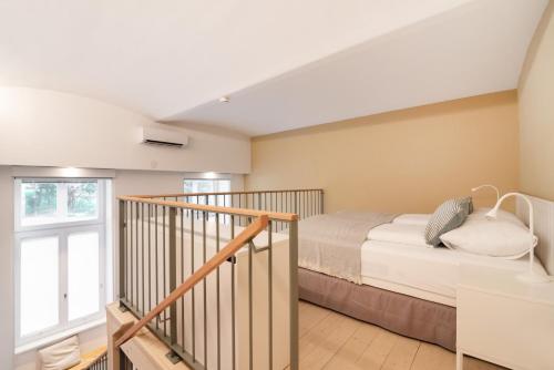 Postel nebo postele na pokoji v ubytování Vorgarten Apartments - central, new and stylish for your comfortable stay in Vienna