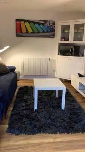a white coffee table in a living room at Lindas LODGE Free PARKING air con plus provisions included in Hove