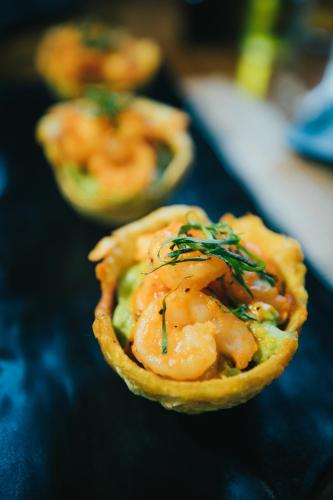 a piece of food with shrimp on a table at Bungalows Punta Uva in Punta Uva