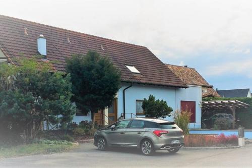 a silver car parked in front of a house at MaNaLa "120 m2" in Algolsheim