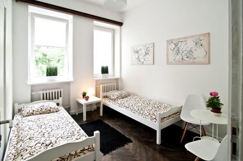Un pat sau paturi într-o cameră la Extra Hostel "Easy Kaunas"