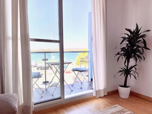 a living room with a view of the ocean at Apartamento Mirando al Guadiana Centro in Ayamonte