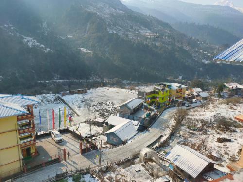 an aerial view of a city with a mountain at The Lachung Inn in Lachung