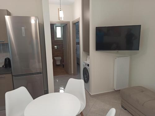 Μια τηλεόραση ή/και κέντρο ψυχαγωγίας στο Cyclops Luxury Apartments