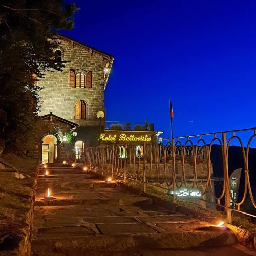 a building with lights in front of it at night at Hotel Bellavista in Abetone