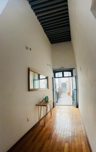 a room with a table in the middle of a room at Markee Hotel Boutique in Querétaro
