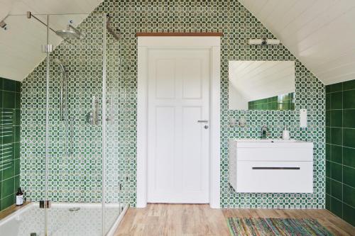 a bathroom with a sink and a mirror at Siedlisko Wnukowo in Szczechy Małe