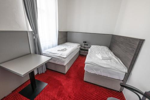 Ένα ή περισσότερα κρεβάτια σε δωμάτιο στο Hotel Třebovská restaurace