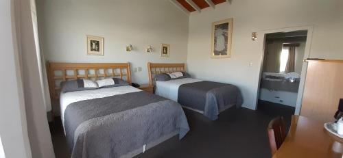 Ένα ή περισσότερα κρεβάτια σε δωμάτιο στο Hotel Villa Fontana Inn